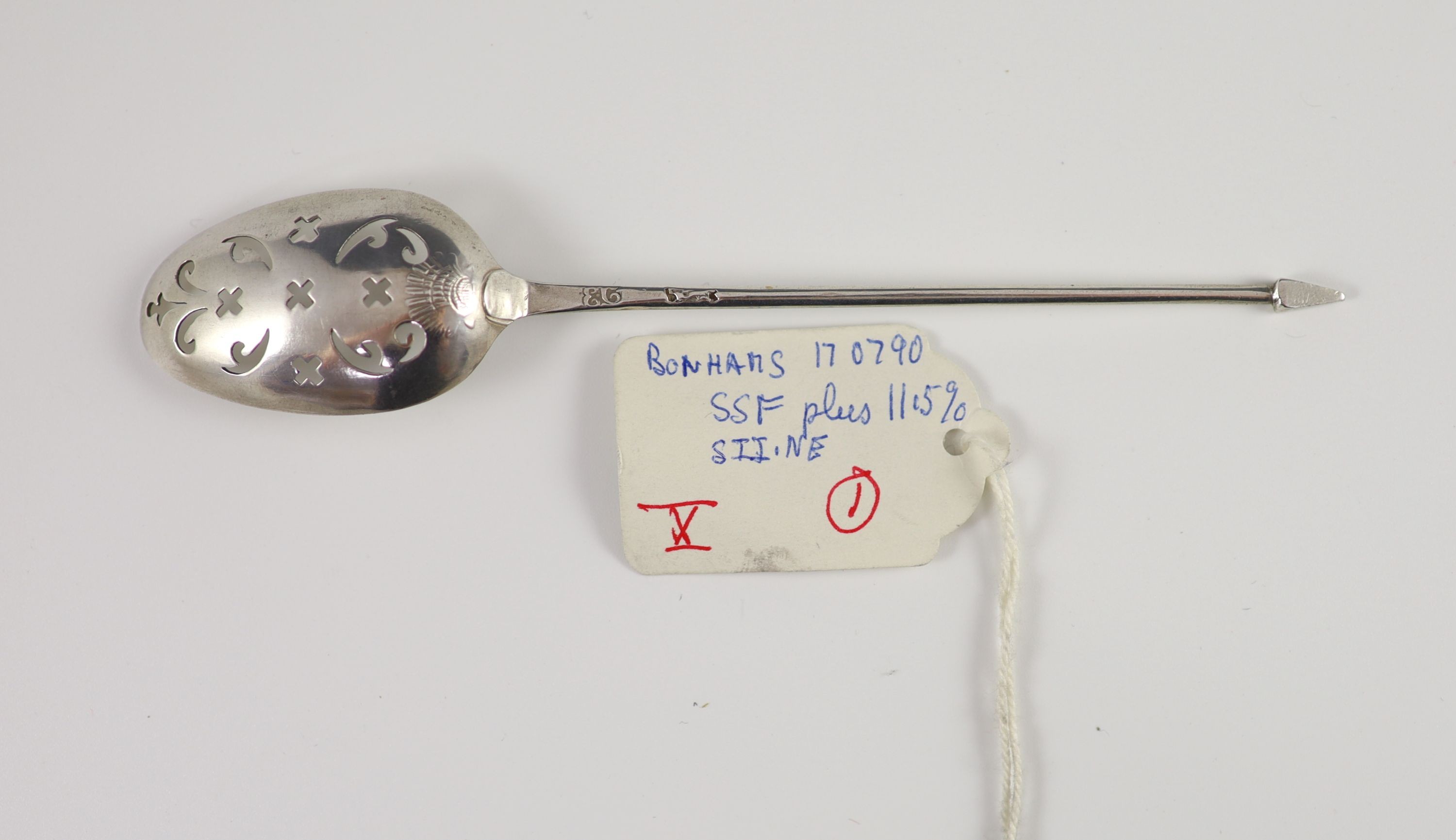 A George II silver mote spoon, c1750 by Ebenezer Coker, the bowl with shell back, 13.7cm.